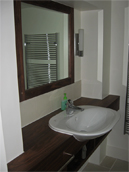 Walnut vanity top and mirror surround